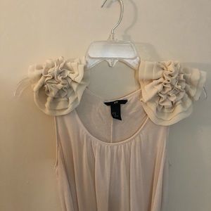 Floor length dress with floral shoulder detail